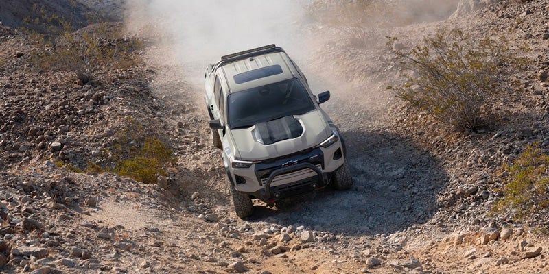 Top view of 2023 Chevy Colorado driving on rocky terrain