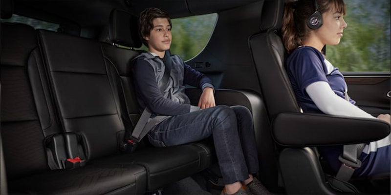 Interior view of kids sitting in the back of a 2023 Chevy Tahoe