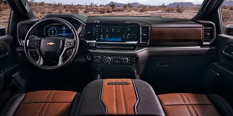 Sleek black and brown leather interior of a 2024 Chevy Silverado HD