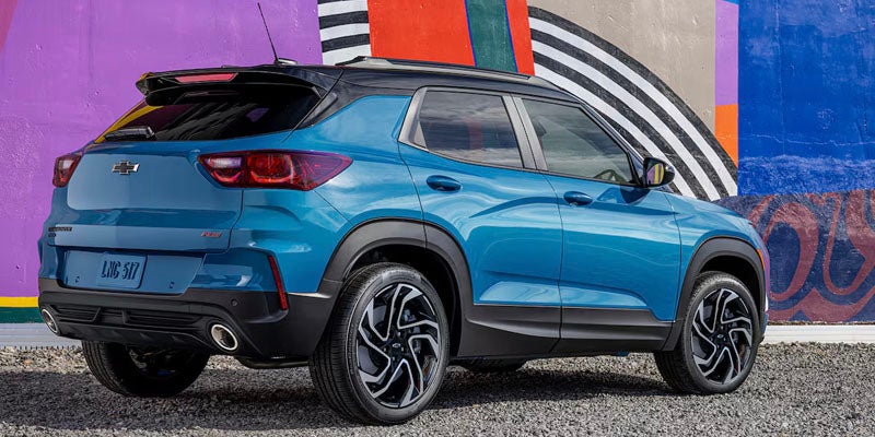 Rear angled view of a blue 2025 Chevy Trailblazer