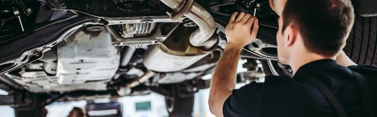 Service technician working on a vehicle