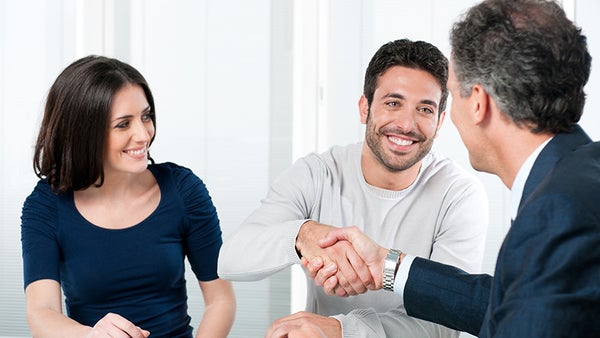 customer shaking hands with salesperson